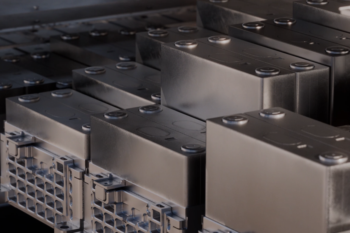 Rows of metal server rack components, some with circular studs, connected to a grid-patterned chassis.